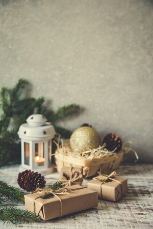 Christmas background. Christmas composition. Christmas gift, pine cones, fir branches on wooden white backgroundの写真素材