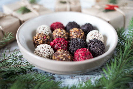 Homemade chocolate truffles on a christmas background.の写真素材
