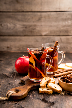 hot spicy beverage. Hot drink (apple tea, punch) with cinnamon stick and star anise. Seasonal mulled drink.の写真素材
