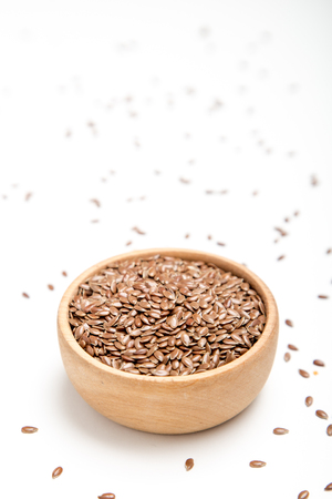 close up of flax seeds on white background. Healthy food concept for preventing heart diseases and overweight.の写真素材