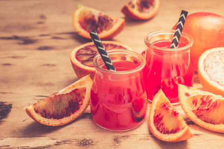 blood orange juice. red orange juice with orange slice. Healthy drink.の写真素材