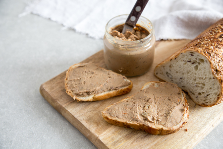 Fresh homemade chicken liver pate (rabbit, goose) with cranberry sauce. Toasted bread with pate.の写真素材