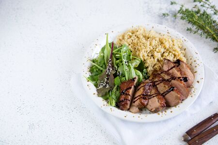 healthy lunch. Serving Couscous with Salad and Roasted Duck Breasts/の写真素材