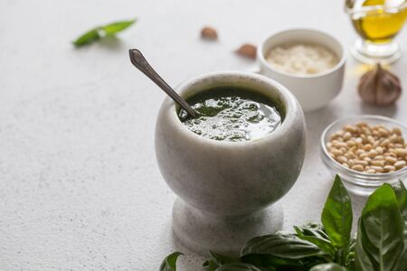 Homemade basil pesto sauce and ingredients. Vegan healthy foodの写真素材