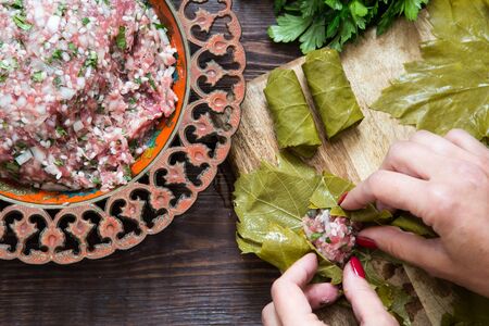 preparing stuffed vine leaves with rice and meat, or traditional Dolma.Top view.の写真素材