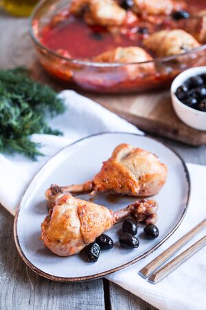 Chicken Cacciatore braised with wine, olives and tomatoes, traditional Italian dishの写真素材