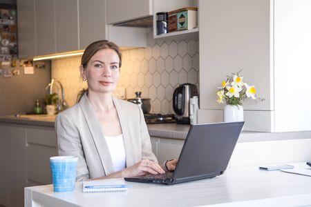 Beautiful young woman working from home. Many stuff to do today. woman work as a freelancer/の写真素材