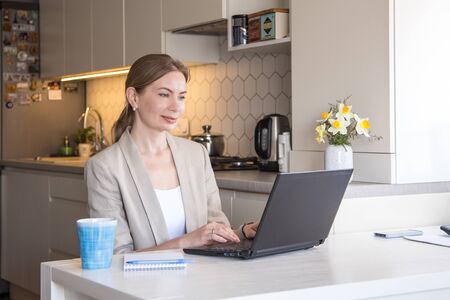 Beautiful young woman working from home. Many stuff to do today. woman work as a freelancer/の写真素材