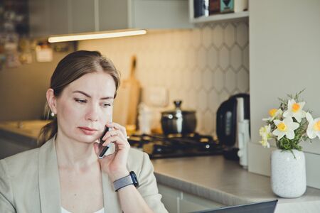 Beautiful young woman working from home. Many stuff to do today. woman work as a freelancer/の写真素材