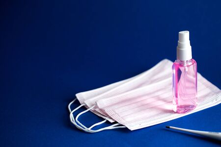 Coronavirus COVID-19 prevention medical surgical masks and hand sanitizer gel for hand hygiene corona virus protection./の写真素材