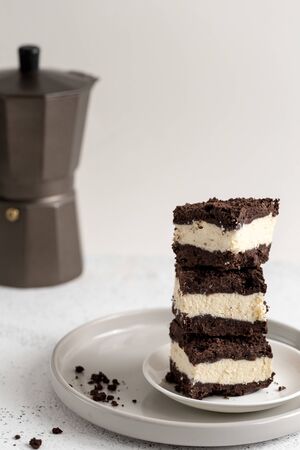 Royal cheesecake with with chocolate crumbs. homemade cottage cheese dessert with chocolate doughの写真素材