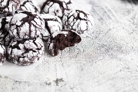 chocolate cookies. homemade chocolate crinkles cookies powdered sugar.の写真素材