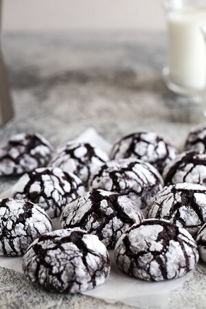chocolate cookies. homemade chocolate crinkles cookies powdered sugar with milk.の写真素材