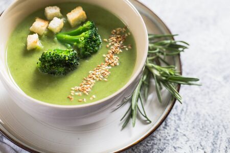 Spring detox Broccoli cream soup with sesame seeds and breadcrumbs. Clean eating, dieting, vegan, vegetarian, healthy food concept.の写真素材