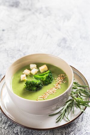 Spring detox Broccoli cream soup with sesame seeds and breadcrumbs. Clean eating, dieting, vegan, vegetarian, healthy food concept.の写真素材