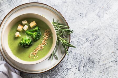 Spring detox Broccoli cream soup with sesame seeds and breadcrumbs. Clean eating, dieting, vegan, vegetarian, healthy food concept.の写真素材