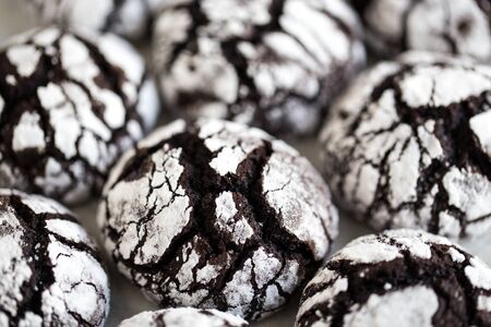 chocolate cookies. homemade chocolate crinkles cookies powdered sugar.の写真素材