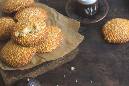 cookies with sesame seeds on wooden background. Healthy snack with sesame /の写真素材