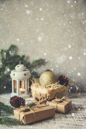 Christmas background. Christmas composition. Christmas gift, pine cones, fir branches on wooden white backgroundの写真素材