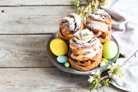 Panetone kulich craffin on wooden background. Easter bread kozunak. copy space concept.の写真素材