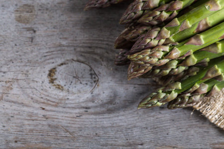green Asparagus. Bunches of green asparagus on a gray wooden rustic backgroundの写真素材