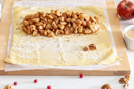 making strudel - dough, apples, cinnamon, nuts, brown sugar. process and ingredients.の写真素材