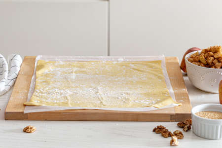 making strudel - dough, apples, cinnamon, nuts, brown sugar. process and ingredients.の写真素材