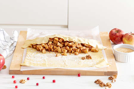 making strudel - dough, apples, cinnamon, nuts, brown sugar. process and ingredients.の写真素材