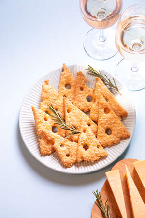 Parmesan savory cookies with rosemary. Salty cheese cookies. Healthy snack. background image. top view, copy space, flat lay.の写真素材