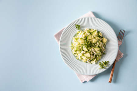 Healthy salad. Detox Spring vegan salad with cabbage, cucumber, green onion and parsleyの写真素材