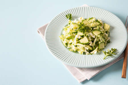 Healthy salad. Detox Spring vegan salad with cabbage, cucumber, green onion and parsleyの写真素材