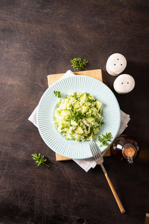 Healthy salad. Detox Spring vegan salad with cabbage, cucumber, green onion and parsleyの写真素材