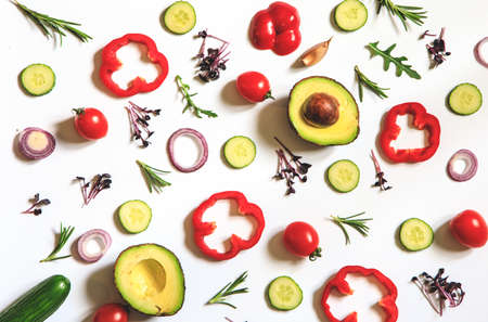Creative layout of tomatoes, cucumbers, bell peppers, avocados and salads. flat lay. Food concept. place for your text.の写真素材