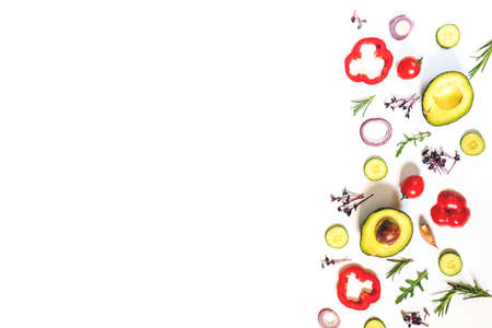 Creative layout of tomatoes, cucumbers, bell peppers, avocados and salads. flat lay. Food concept. place for your text.の写真素材