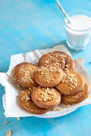 homemade shortbread cookies with peanuts on a trendy blue background. peanut cookie. flat lay, place for text, food background.の写真素材