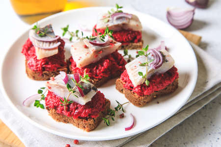 herring appetizer. Herring with beets on rye bread. Brain food concept. Home cooking.の写真素材
