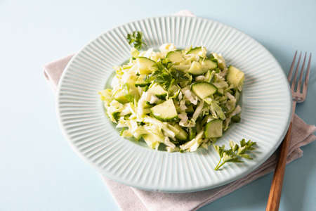 Healthy salad. Detox Spring vegan salad with cabbage, cucumber, green onion and parsleyの写真素材