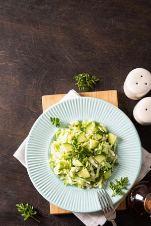 Healthy salad. Detox Spring vegan salad with cabbage, cucumber, green onion and parsleyの写真素材