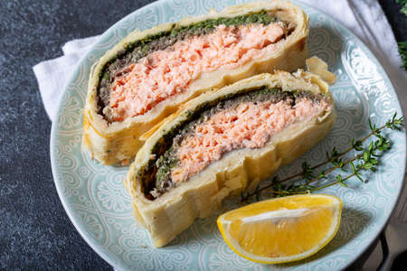 Homemade Salmon Wellington. It is made from Salmon Fish, spinach, mushrooms, spices, herbs and puff pastry. Copy spaceの写真素材