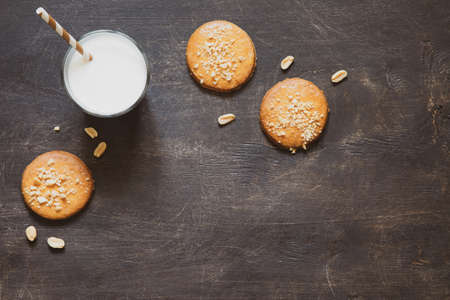 homemade shortbread cookies with peanuts on a wooden background. peanut cookie. flat lay, place for text, food background.の写真素材