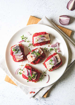 herring appetizer. Herring with beets on rye bread. Brain food concept. Home cooking.の写真素材