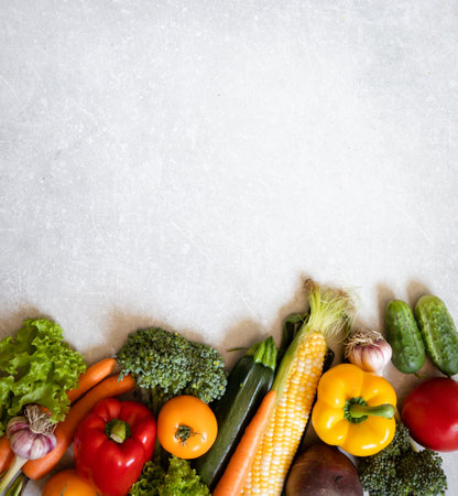 Healthy food background. Healthy vegan vegetarian food. Fresh raw salad ingredients, vegetables tomatoes cucumbers lettuce pepper. copy space, selective focusの写真素材
