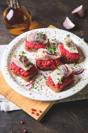 herring appetizer. Herring with beets on rye bread. Brain food concept. Home cooking.の写真素材