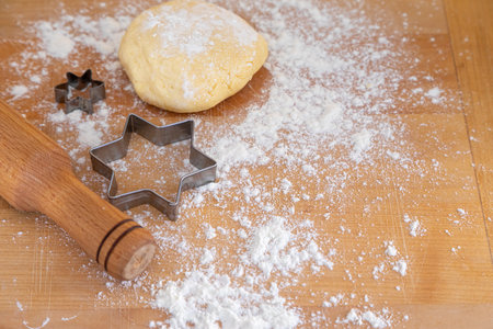 Dough, rolling pin and flour on table, dough kneading with rolling pin, bakery and patisserie or baker shop poster, cooking baking.の写真素材