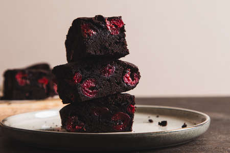 brownie with cherry. A stack of chocolate brownies, homemade bakery and dessert. Bakery, confectionery conceptの写真素材
