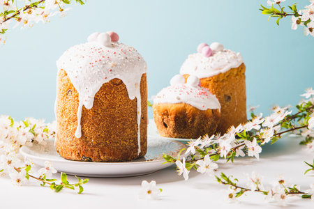 Easter cake with glace icing and decoration. Postcard with Easter bread. Christian tradition. copyspace. white backgroundの写真素材