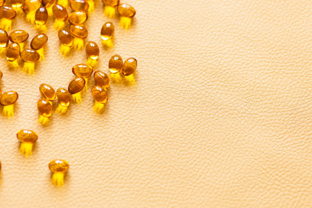 Vitamin D3 capsules. Medicine vitamins and dietary supplements. selective focus. Close up of oil filled capsules suitable for: fish oil, omega 3, omega 6, omega 9, vitamin A, vitamin D, vitamin D3, vitamin Eの写真素材
