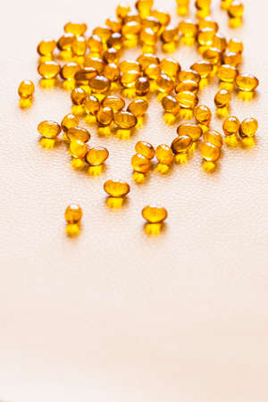 Vitamin D3 capsules. Medicine vitamins and dietary supplements. selective focus. Close up of oil filled capsules suitable for: fish oil, omega 3, omega 6, omega 9, vitamin A, vitamin D, vitamin D3, vitamin Eの写真素材