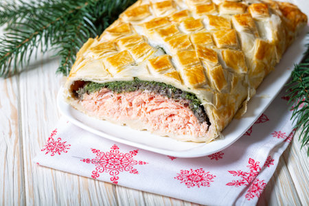 Homemade Salmon Wellington. It is made from Salmon Fish, spinach, mushrooms, spices, herbs and puff pastry. Copy spaceの写真素材