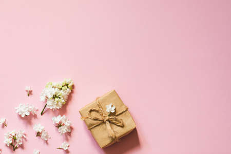 lilac flowers with eco gift box from kraft paper. Creative congratulations layout. spring flower conceptの写真素材